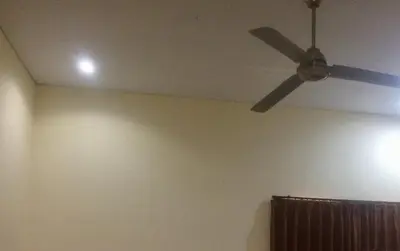 a ceiling fan in a room with a wall at Simple apartment 1 Number 146 c in Seminyak