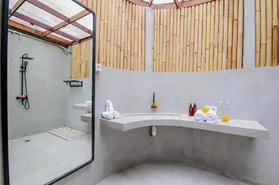 a bathroom with a sink and a mirror at Villa Malou in Seminyak