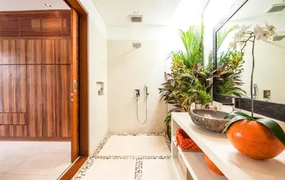 a bathroom with a sink and some plants at Stunning 6 Bedroom Villa Only 400m to the Beach in Canggu