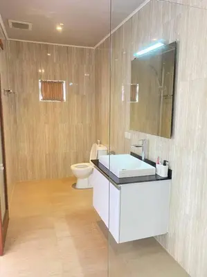 a bathroom with a sink and a toilet at Villa Akmali Umalas 2BR with Private Pool & Jacuzzi in Canggu