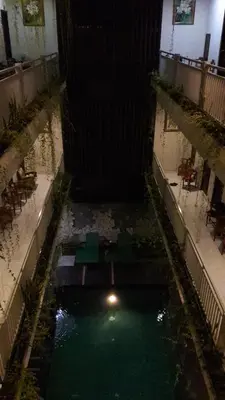 an overhead view of a pool of water in a building at The Agung Residence in Seminyak