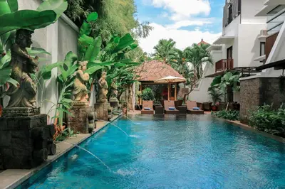 a swimming pool in the middle of a building at Argya Santi Suites and Villas Seminyak in Seminyak