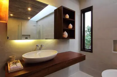 a bathroom with a bowl sink and a mirror at Abivilla in Seminyak