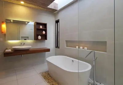 a bathroom with a white tub and a sink at Abivilla in Seminyak
