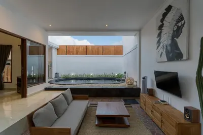 a living room with a couch and a tub at Villa Skyler Seminyak in Seminyak
