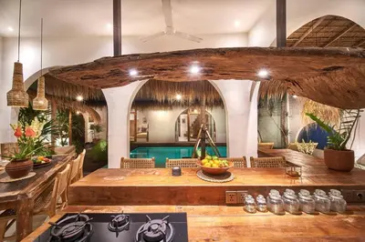 a living room with a table and a pool at Gorgeous Mediterranean Style 2 Bed, Top Pick! in Canggu