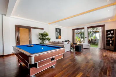 a large living room with a pool table at Villa Tramonto By Le Cielo in Canggu