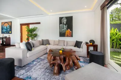 a living room with a couch and a coffee table at Villa Tramonto By Le Cielo in Canggu