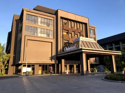a large building with a sign on the front of it at Cozy Minimalist Apartment Lavaya N511 in Nusa Dua