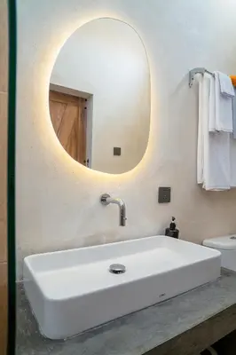 a bathroom with a white sink and a mirror at Alaya Homes A - Luxury Japandi Loft Suite in Seminyak in Seminyak