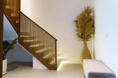a staircase with a vase with a plant in it at Premier Umalas Villas in Seminyak