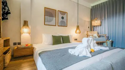 a bedroom with a bed with towels on it at Alaya Homes B - Stylish Japandi Loft Suite in Seminyak in Seminyak