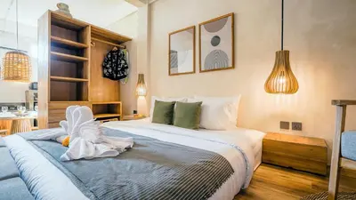 a bedroom with a large bed in a room at Alaya Homes B - Stylish Japandi Loft Suite in Seminyak in Seminyak