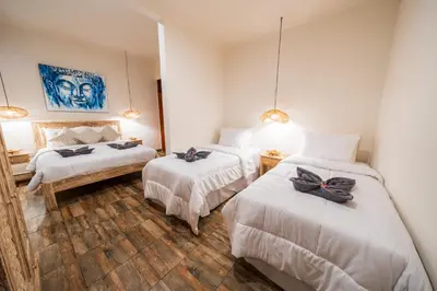 a room with three beds with bows on them at Villa WES - Legian - 5 Bedroom - 4 Bath - Location in Seminyak