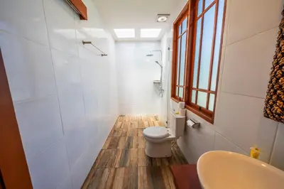 a bathroom with a toilet and a sink at Villa WES - Legian - 5 Bedroom - 4 Bath - Location in Seminyak