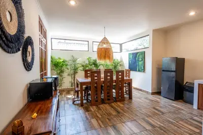 a kitchen and dining room with a table and chairs at Villa WES - Legian - 5 Bedroom - 4 Bath - Location in Seminyak