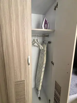 a door with a towel hanging on a rack at Villa de Mer Bali in Legian