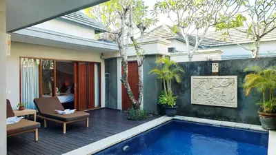 a patio with a swimming pool in a house at The Light Exclusive Villas and SPA in Seminyak