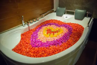 a bathroom sink with a heart made out of sprinkles at The Light Exclusive Villas and SPA in Seminyak