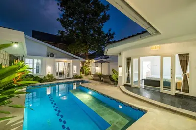 a swimming pool in the backyard of a house at LaLeBay Villa Seminyak in Seminyak