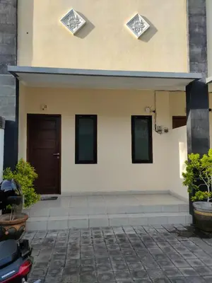 a entrance to a building with a door at Bali Holiday Guesthouse near IALF & Benoa in Pesanggaran