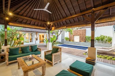 an outdoor living room with a couch and a table at 2 Bedroom Villa private Pool and BBQ Seminyak Bali in Seminyak