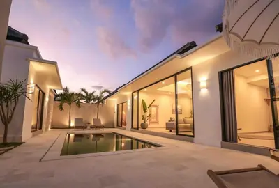 an exterior view of a house with a swimming pool at Villa Efire-3 bedroom with pool in Seminyak
