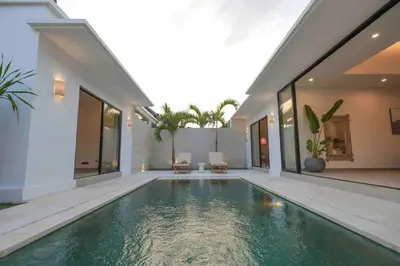 a swimming pool in the backyard of a house at Villa Efire-3 bedroom with pool in Seminyak