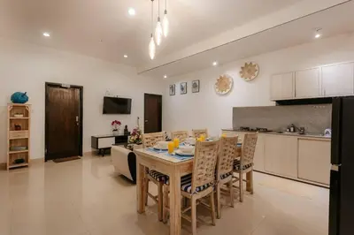 a kitchen and dining room with a table and chairs at Villa Sri, Seminyak - 3 Bedroom Stylish Pool Villa! in Seminyak
