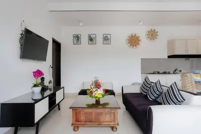 a living room with a couch and a table at Villa Sri, Seminyak - 3 Bedroom Stylish Pool Villa! in Seminyak