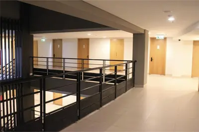 an empty hallway with stairs in a building at Anagata 1 Tanjung Benoa Bali in Nusa Dua