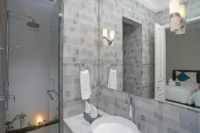 a bathroom with a sink and a mirror at Villa Ley Charming 2 Bedroom Villa Seminyak Private Pool in Seminyak
