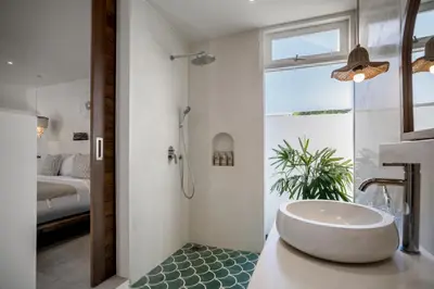 a bathroom with a tub and a shower and a sink at Villa Passion by Alfred in Bali in Seminyak