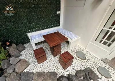 an overhead view of a wooden table and benches at YuRooms Villapartment - Love Room Bali in Jimbaran