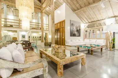 a living room with white furniture and a wooden ceiling at Luxurious&Spacious 4Br Villa in Seminyak in Seminyak