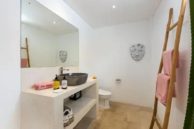 a bathroom with a sink and a toilet at Wonderful 4Br Villa in Seminyak in Seminyak