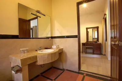a bathroom with a sink and a mirror at Clasic Private Pool Villa in Seminyak in Seminyak