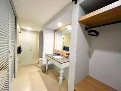 a bathroom with a sink and a mirror at Astana Residence in Seminyak