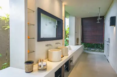 a bathroom with two sinks and a mirror at Exquisite 4BD Luxury Villa in the Heart of Berawa in Canggu