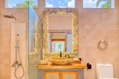 a bathroom with a sink and a mirror at Villa San Diego: Brand New 4BDR in Seminyak