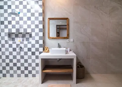 a bathroom with a sink and a mirror at Simple & Magical Villas Almaya 2 in Canggu