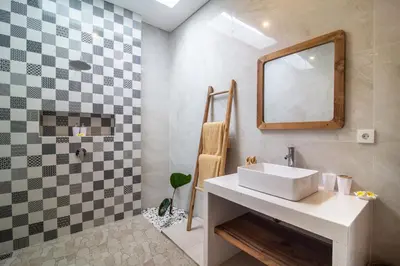 a bathroom with a sink and a mirror at Simple & Magical Villas Almaya 2 in Canggu