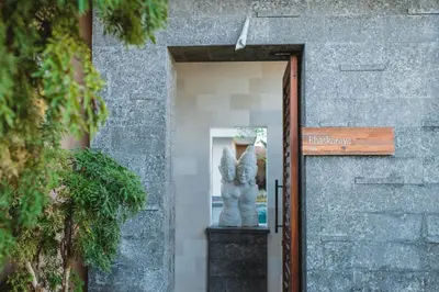 a statue sitting in the doorway of a building at The Kasih Villas & Spa in Seminyak