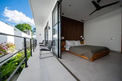 a bedroom with a bed on a balcony at Two-Bedroom Pool Villa at Anwa Residences in Canggu