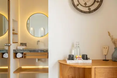 a bathroom with a sink and a mirror at Mysa Boutique Hotel in Seminyak