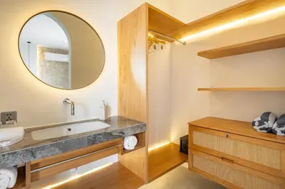 a bathroom with a sink and a mirror at Mysa Boutique Hotel in Seminyak