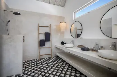 a bathroom with a sink and a mirror at Villa Makena by Alfred in Bali in Seminyak
