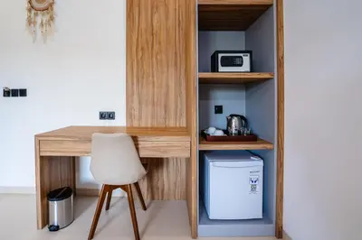 a desk with a chair and a trash can at Villa Waldo - 6 bedroom High End Luxury Villa in Batu Belig, Seminyak in Canggu