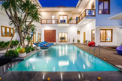a swimming pool in a home with a house at Villa Waldo - 6 bedroom High End Luxury Villa in Batu Belig, Seminyak in Canggu