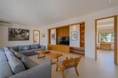 a living room with a couch and a table at Amenara Estate by LifestyleRetreats in Canggu